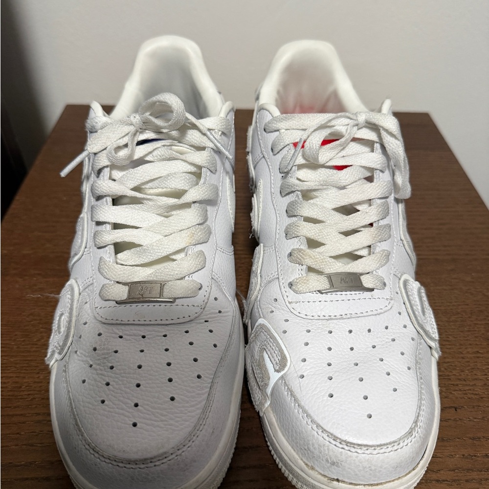 Nike Men’s White Leather Low-Top Sneakers with Subtle Red Accent